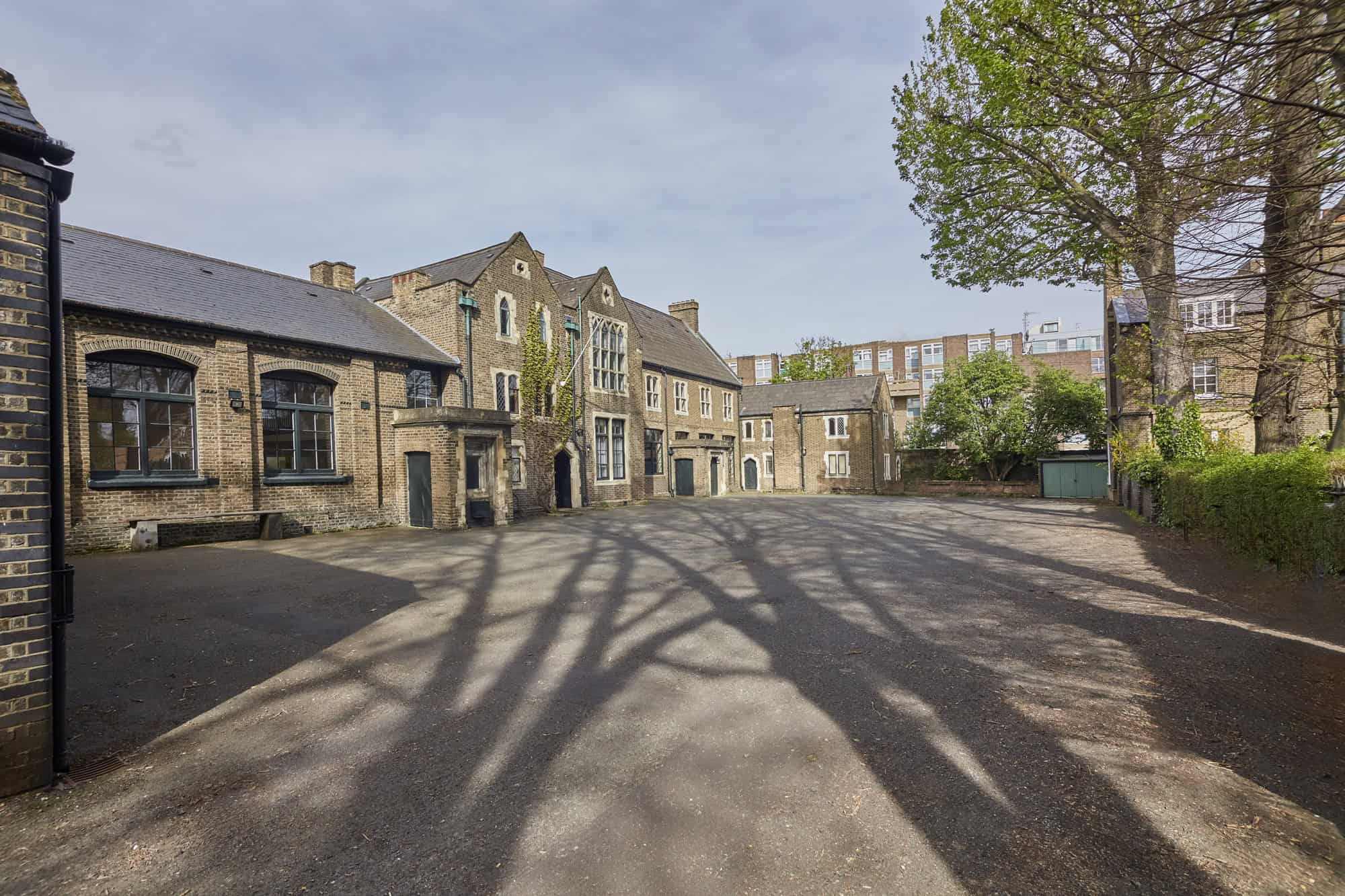 The courtyard, ringed by Victorian brick buildings