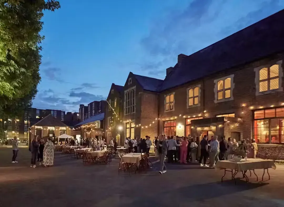 The courtyard in full swing, festoon lighting overhead