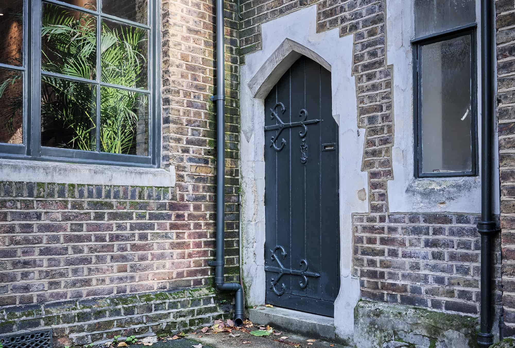 Gothic arched doorway with ironwork hinges
