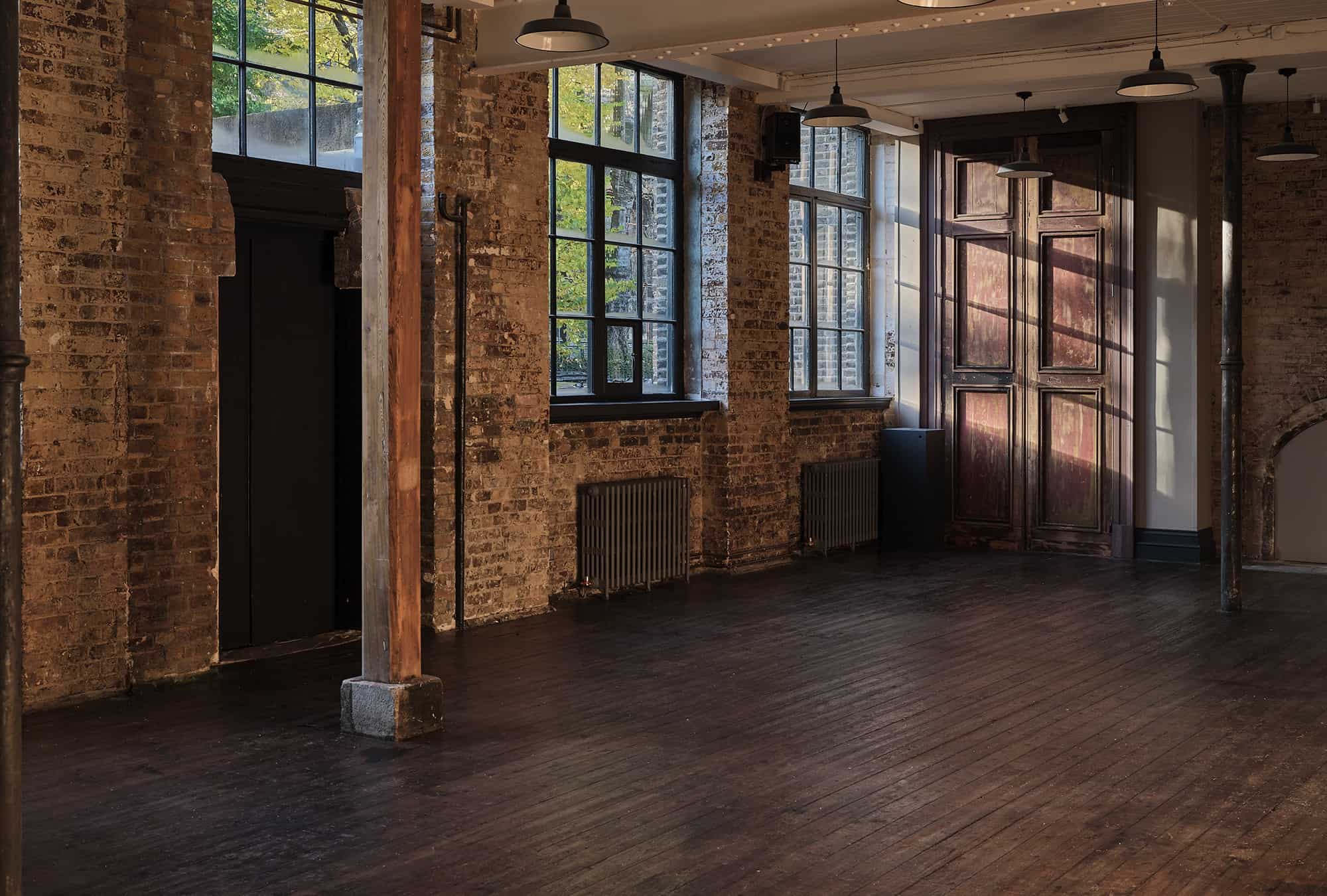 Tall windows and reclaimed panelled doors in the hall